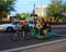 USA, Arizona/Tempe: Bike Taxi Driver and Passengers on St. Patricks Day