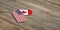 USA and Canada military relations, Identification tags on wooden background. 3d illustration