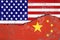 USA and China conflict concept.Flags of USA and China painted on cracked wall