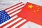 USA & China - disagreement, US of America and Chinese flags. Relationship conflict between USA and China. Trade deal