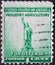 USA - Circa 1940: a postage stamp printed in the US showing the Statue of Liberty, blue green Text: Industry agriculture for defen