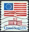 USA - CIRCA 1975: A stamp printed in USA showing 13 star flag over Independence Hall, circa 1975.