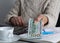 USA currency. Dollars. Retired woman showing bill on desk office