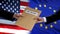 USA and European Union politicians exchanging top secret envelopes against flags