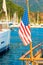 USA flag on the background of the masts of yachts