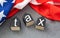 USA flag, gavel and cubes with word tax as a symbol of avoidance or fraud.