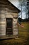 USA Flag Hangs From an Old Cabin