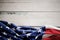 USA Flag Lying on Vintage Weathered Wooden Background. American Symbolic. 4th of July or Memorial Day of United States