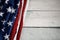 USA Flag Lying on Vintage Weathered Wooden Background. American Symbolic. 4th of July or Memorial Day of United States