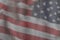 USA flag on a textured background. USA flag on old grunge background wall, demolition concept