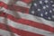 USA flag on a textured background. USA flag on old grunge background wall, demolition concept