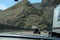 USA. Grey mountains Nevada. Highway cross canyon. Geological structure. Cliffs and rocks.