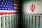 USA and Iran military conflict. Many missiles in front of American and Iran flags.