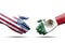 USA and Mexico flag print screen on handshake with white background.It is symbol of economic tariffs trade war and tax barrier