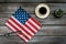 USA national day background with flag, glasses and cup of coffee on wooden desk top view