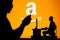 USA, SEATTLE, JANUARY 30, 2023: Amazon. The Intersection of Personal and Professional: Silhouette of Man and Web Developer