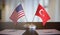 USA and Turkish flags on table. Negotiation between Turkey and United states. 3D rendered illustration.