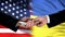 USA and Ukraine officials exchanging money, flag background, cooperation