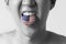 USA or United States flag painted in tongue of a man - indicating English language and American accent speaking, study in