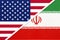 USA vs Islamic Republic of Iran national flag from textile. Relationship between two american and asian countries