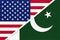 USA vs Pakistan national flag from textile. Relationship between two american and asian countries
