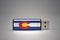 Usb flash drive with the colorado state flag on gray background.