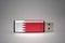 Usb flash drive with the national flag of bahrain on gray background.