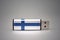 Usb flash drive with the national flag of finland on gray background.