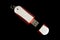 USB Memory Stick - Metal and red flash drive on an isolated black background
