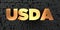 Usda - Gold text on black background - 3D rendered royalty free stock picture