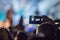 Use advanced mobile recording, fun concerts and beautiful lighting, Candid image of crowd at rock concert, Close up of