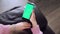 Use green screen for copy space closeup. Chroma key mock-up on smartphone in hand. Woman holds mobile phone iPhone and