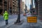 Use other footpath traffic warning sign barrier applying on busy street downtown on pedestrian footpath