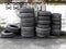 Used car tires pile in the tire repair shop yard