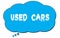 USED  CARS text written on a blue thought bubble