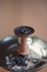 Used ceramic hookah bowl with tobacco