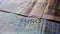 Used crumpled shabby banknotes of fifty and twenty Euro close up.