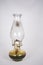 Used oil lamp on white