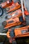 Used orange hydraulic floor jacks on concrete floor