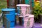 The used paint cans. Colorful paint buckets.