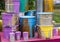 The used paint cans. Colorful paint buckets.