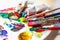 Used palette of the artist with mixed colors of acrylic paints c