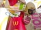 Used paper wrappings and disposable packs with McDonalds design and logo in pile on table. McDonalds recycle trash after usage