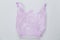 Used purple plastic disposable bag on gray background