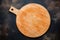 Used round wooden cutting board for pizza on stone background. Top view. Mock up for food project