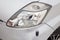 Used silver Toyota Passo with an engine of 1.3 liters front headlight view on the car snow parking after preparing for sale