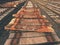 Used sleepers stock in railway depot. Old, dirty and rusty used concrete railway ties stored