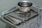 Used surgical instruments on a stainless tray