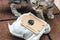 Used synthetic vacuum cleaner bag and scottish fold cat on brown mat background