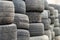 Used wheel tires stacked ready for recycling.